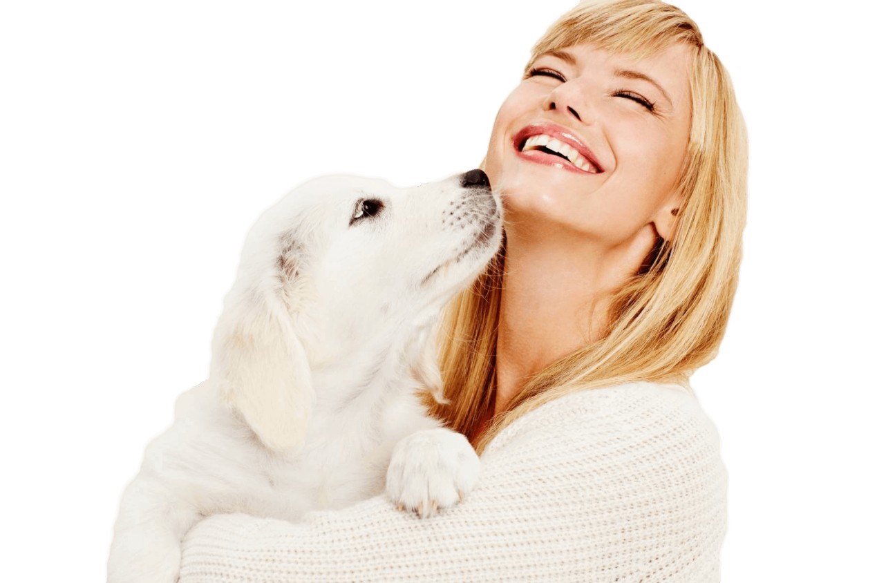 A happy dog giving its owner a kiss