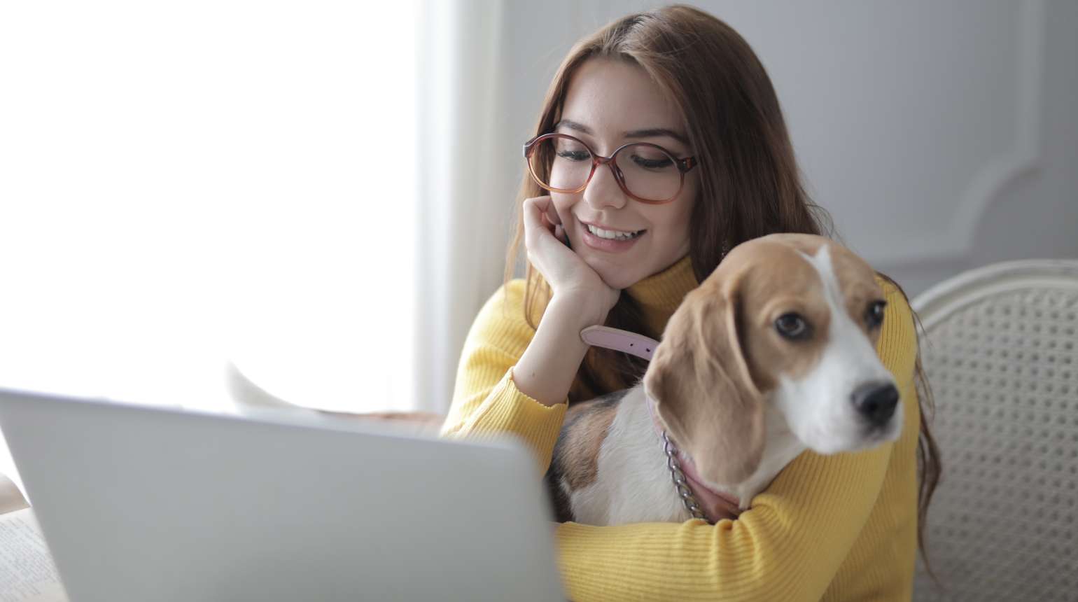 A pet parent enjoying time at home with their dog